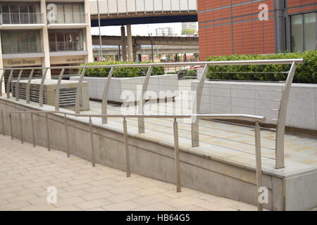 Long silver railing leading the street Stock Photo