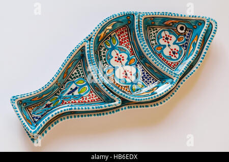 Decorative ceramic fish serving dish handmade in Tunisia isolated on white background Stock Photo