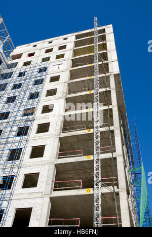 Construction of office building from glass and concrete Stock Photo