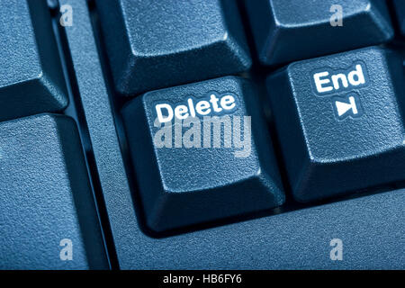 Electronic collection - detail black computer keyboard. The focus on Delete key. Toning is blue. Stock Photo