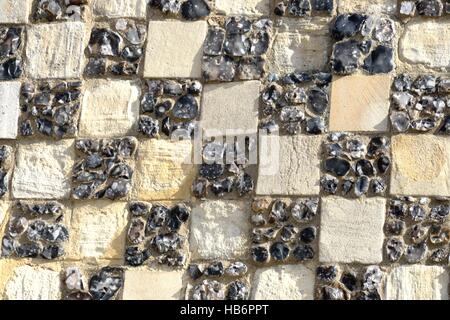 Chequerd stone detail on ancient  building Stock Photo