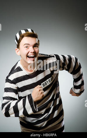 Funny prisoner in prison concept Stock Photo