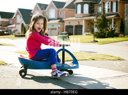 girl riding scooter Stock Photo