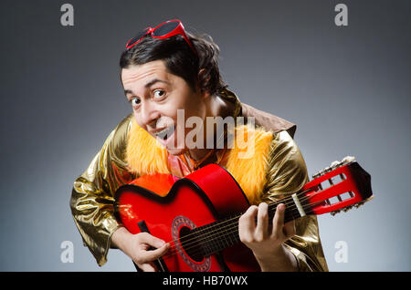 Man with guitar in musical concept Stock Photo