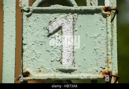 Old retro cast iron plate number 1 Stock Photo