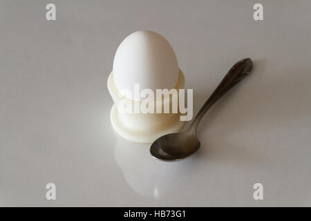 Boiled egg with spoon Stock Photo