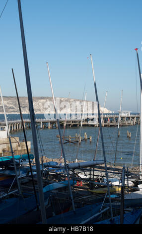 Swanage Sailing Club, the Pier and Ballard Cliffs in the distance. Stock Photo
