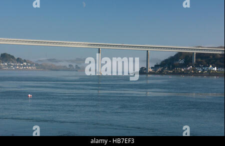 Midday in December mist rolls down the Cleddau and under the Cleddau Bridge, Pembroke Dock, Milford Haven,  Pembrokeshire Stock Photo