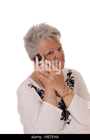 Senior woman talking on her cell phone. Stock Photo