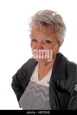 Closeup of senior woman standing in a coat. Stock Photo