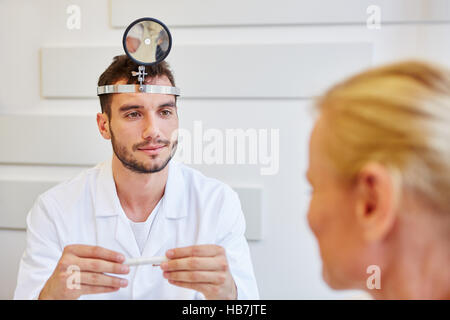 ENT physician in consultation listening to patient Stock Photo