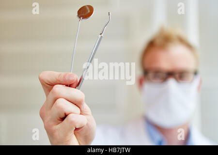 Probe and mirror as dental instruments for examination Stock Photo