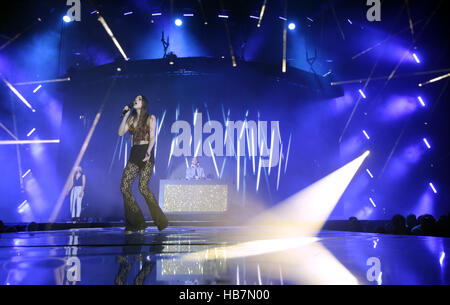 Singer Birdy performs with Sigma on stage at Capital's Jingle Bell Ball with Coca-Cola at London's O2 arena. Stock Photo