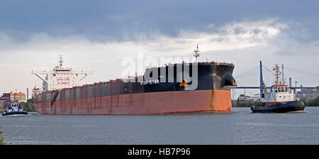 cargo ship and towboats harbour, Hamburg, Germany Stock Photo