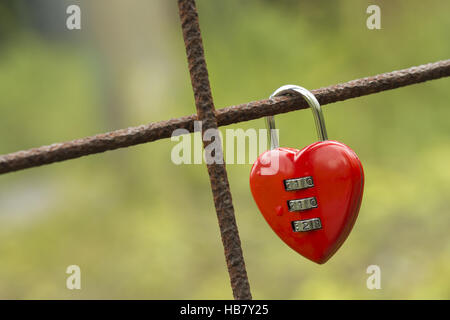 Red padlock in heart shape Stock Photo
