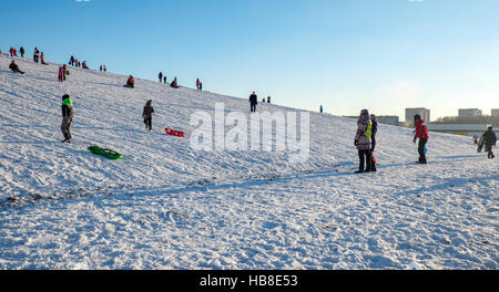 Snow sledding hill in Riga is joy for children and adults. Stock Photo