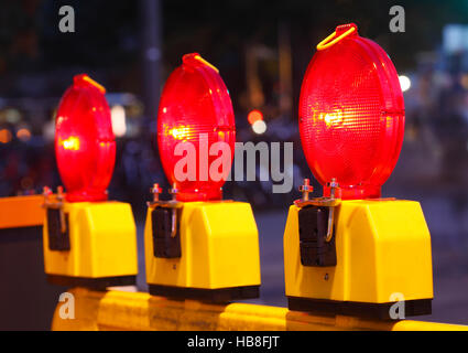 Flashing lights on road barrier, night, Bremen, Germany Stock Photo