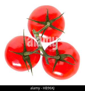 Three cherry tomatoes on vine Stock Photo