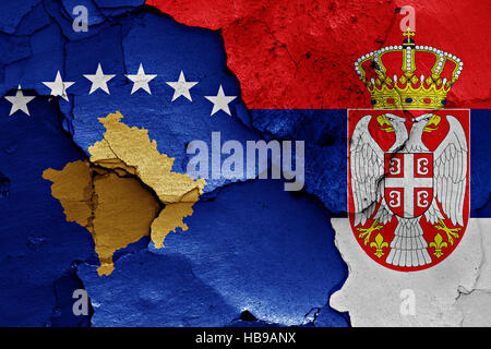 flags of Kosovo and Serbia painted on cracked wall Stock Photo