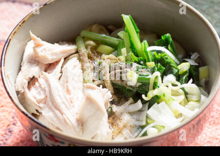 Japanese cuisine, Japanese noodles called ramen with chicken, vegetables, and chopped green onion Stock Photo