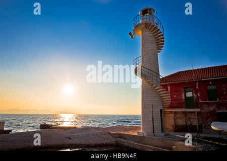 Lighthouse in Zadar at sunset Stock Photo