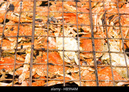 Grilled crab on flaming grill. Stock Photo