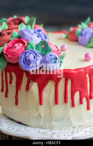 Cake with red chocolate and flowers. Stock Photo