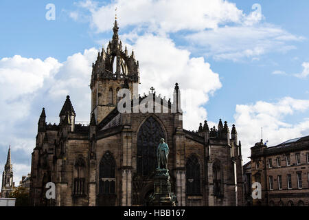 West exterior of Saint Giles Cathedral and bronze statue of Walter Francis Montagu Douglas Scott, 5th Duke of Buccleuch Stock Photo