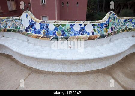 Spain, Barcelona, Park Guell, serpentine bench with Trencadis mosaic by Gaudi from broken tile shards Stock Photo