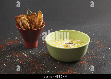 Pumpkin soup and bread Stock Photo