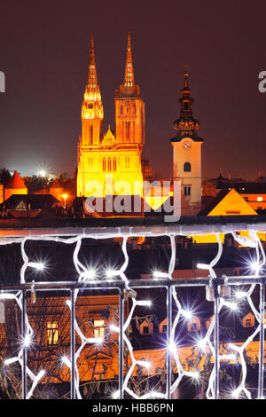 Christmas in Zagreb: the Cathedral seen above an illuminated fence Stock Photo