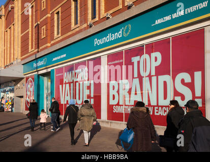 Poundland store on the Golden Mile, Blackpool seaside resort, shops and shoppers in the resort, Lancashire, UK Stock Photo