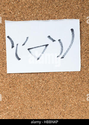 The series of Japanese emoticons called Kaomoji on the cork board, joyful Stock Photo