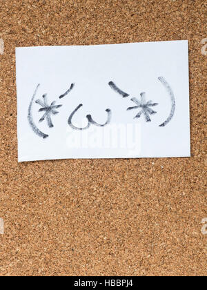 The series of Japanese emoticons called Kaomoji on the cork board, content Stock Photo