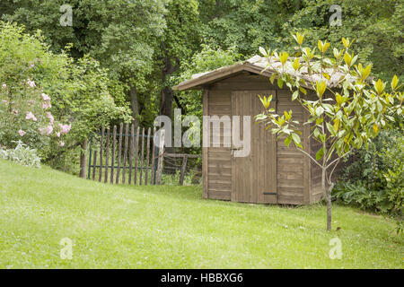 garden hut and an old gate Stock Photo