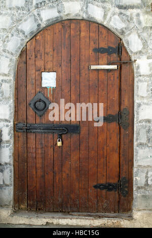 Traditional wooden door at entrance to Skouna nightclub in Roda Corfu Greece Stock Photo