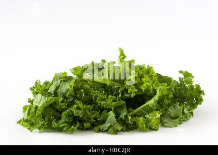 Fresh green superfood kale leaves isolated on white background Stock Photo