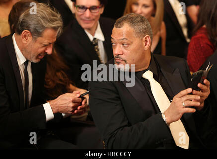 Washington, Us. 04th Dec, 2016. Actor Jeff Goldblum (L) and actor Laurence Fishburne (R) wait for the beginning of an event for the 2016 Kennedy Center Honorees, in the East Room of the White House, December 4, 2016. The 2016 honorees are: Argentine pianist Martha Argerich; rock band the Eagles; screen and stage actor Al Pacino; gospel and blues singer Mavis Staples; and musician James Taylor. Credit: Aude Guerrucci/Pool via CNP - NO WIRE SERVICE - Photo: Aude Guerrucci/Consolidated/dpa/Alamy Live News Stock Photo