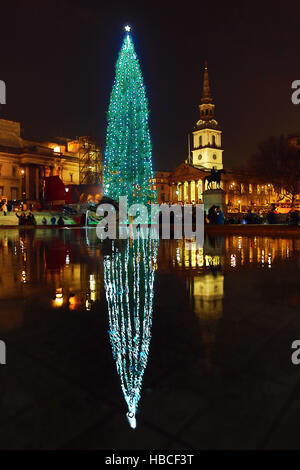 London, UK. 5th December 2016. Trafalgar Square Christmas Tree, St Martins in the Fields church and reflection, Trafalgar Square, London Credit:  Paul Brown/Alamy Live News Stock Photo