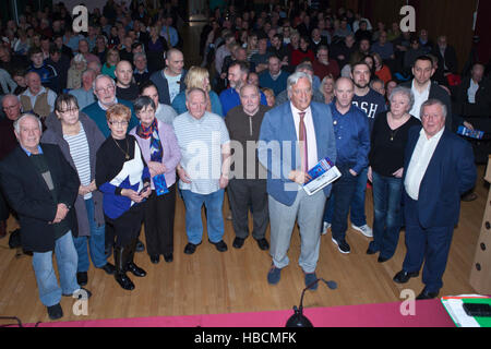 Belfast, UK. 6th December 2016. Barrister Michael Mansfield QC with some of the relatives of the 15 people killed in the 1971 McGurk’s Bar bombing, during a lecture at St Mary’s College in West Belfast. Credit:  Bonzo/Alamy Live News Stock Photo