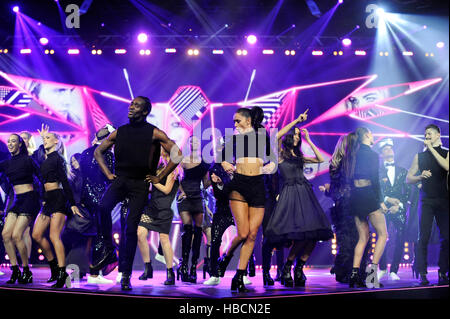 Party atmosphere on stage as the models and dancers finish their last performance in the Rock The Runway themed Alcatel Fashion Theatre during the fifth and final day of The Clothes Show, NEC, Birmingham, UK. Running from 2-6 December 2016, with the usual exciting mix of fashion, beauty, celebrities, music, and industry experts, The Clothes show was taking place for the final time at the NEC. After 27 successful years at the NEC, the Clothes Show will relocate to Liverpool in July 2017. Credit:  Antony Nettle/Alamy Live News Stock Photo