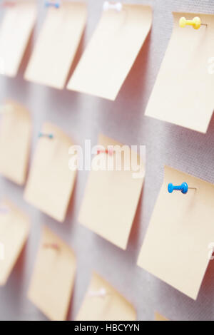 Sticky notes on a bulletin board Stock Photo