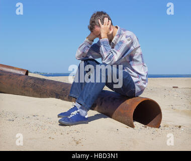 Lonely young man suffering from depression Stock Photo