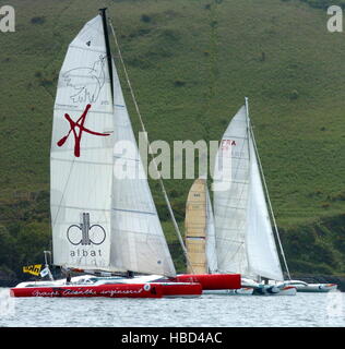 AJAXNETPHOTO. 29TH MAY, 2005. PLYMOUTH, ENGLAND. - FARADAY MILLS OSTAR 2005 - MULTIHULLS AT THE START OF TODAY'S RACE OFF PLYMOUTH. PHOTO:TONY CARNEY/ACME/AJAX REF:OSTAR04 Stock Photo