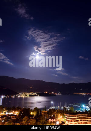 Budva city and bay at night, Montenegro, Europe. Street and moon light, vertical view Stock Photo