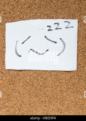 The series of Japanese emoticons called Kaomoji on the cork board, sleeping Stock Photo