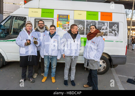 Bagnolet, France, Group of Young French People, Volunteers, AIDS HIV Testing on Street Militants, of NGO AIDES, on street, with Prevention Information Truck 'World AIDS Day' HIV gay Community health workers, epidemic and plague france Stock Photo