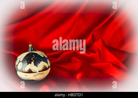 fiery-red background for congratulations on Christmas and New Year with different toys Stock Photo