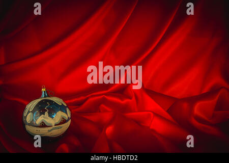 fiery-red background for congratulations on Christmas and New Year with different toys Stock Photo