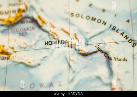 Photo of a map of Solomon Islands and the capital Honiara . Stock Photo